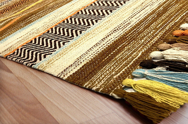 Beige striped kilim rug flat lay showing diamond pattern