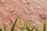 Pink kilim rug texture close-up