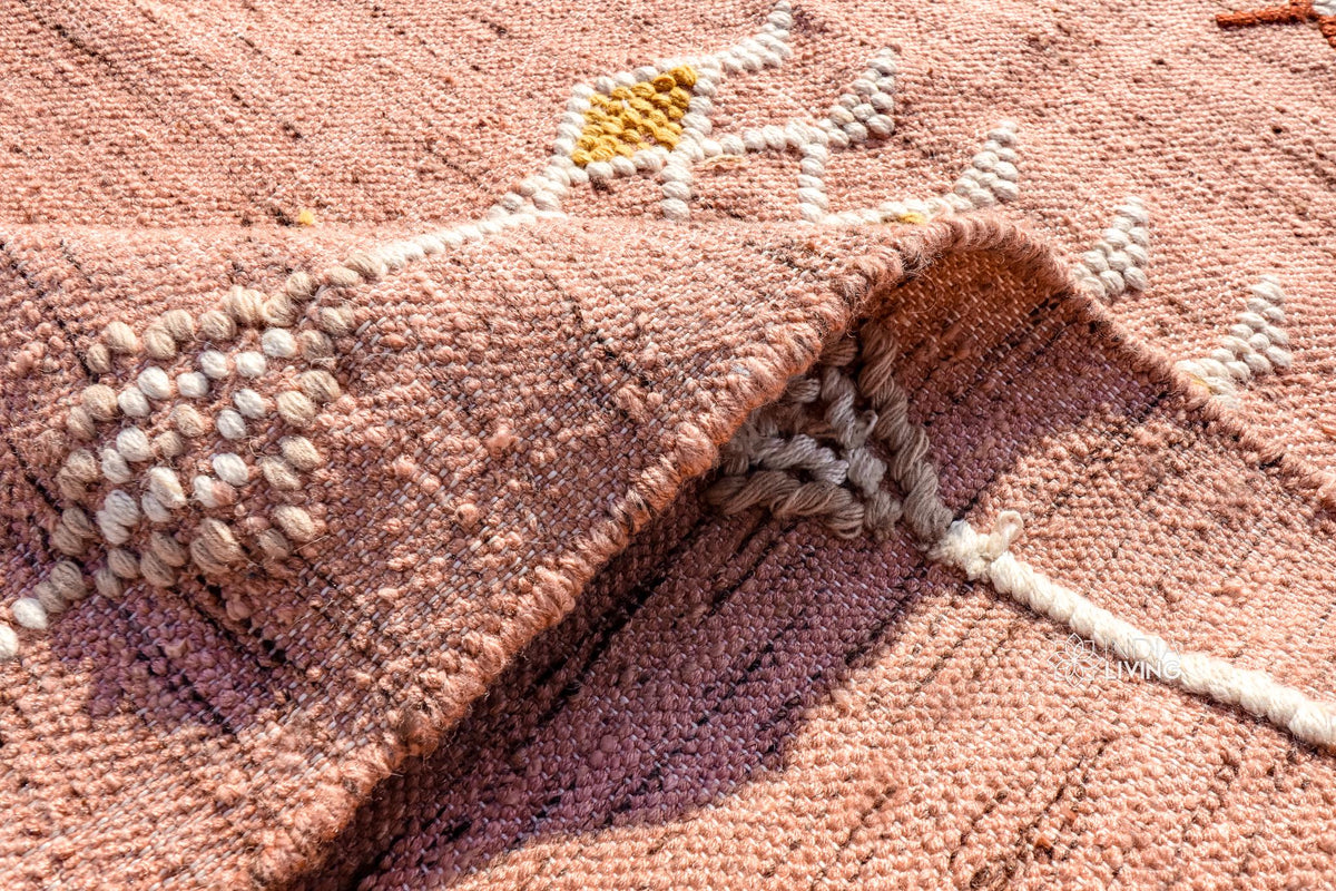 Pink kilim rug corner detail