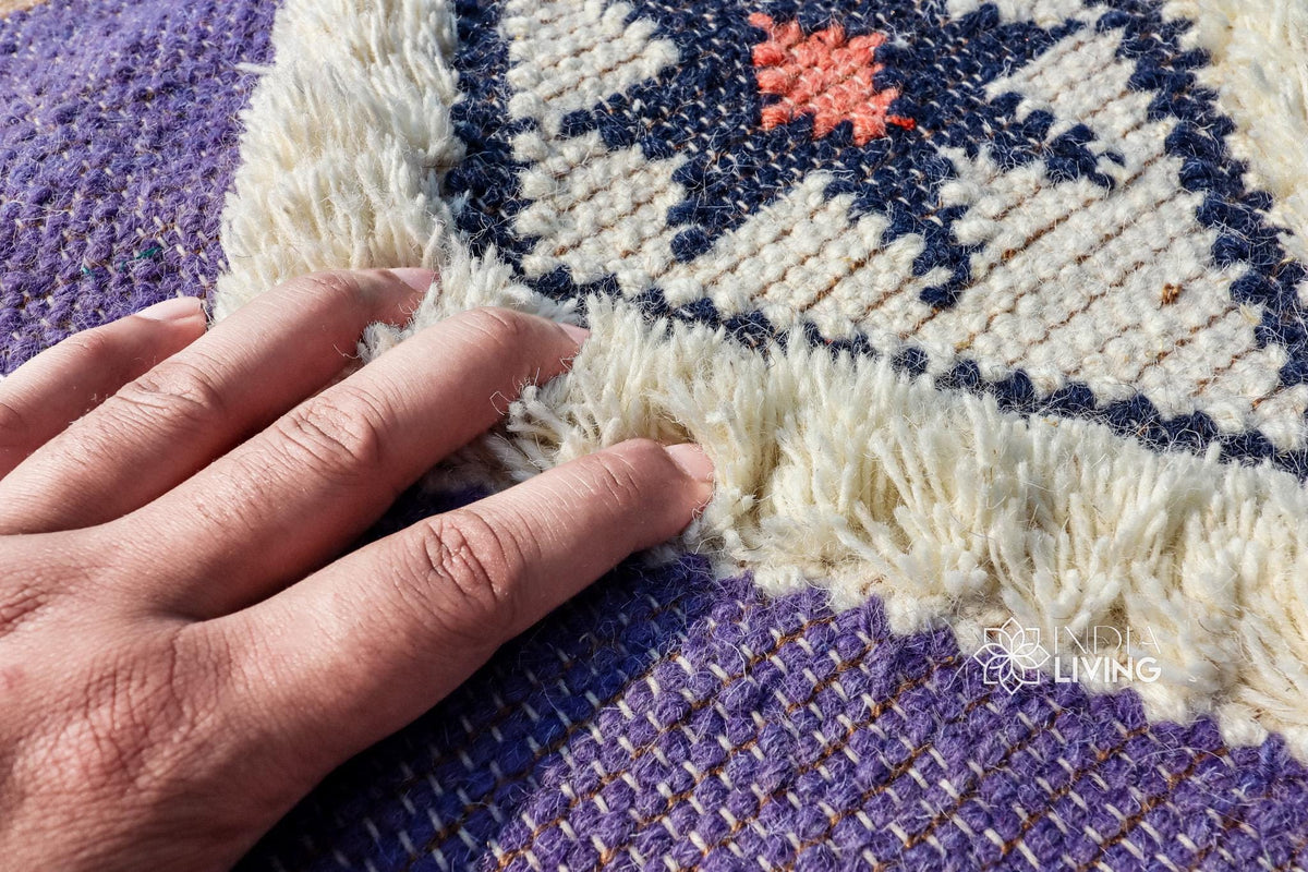 Mauve wool rug placed in bedroom setting