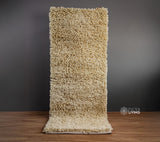 Ivory shag wool rug full flat lay top view