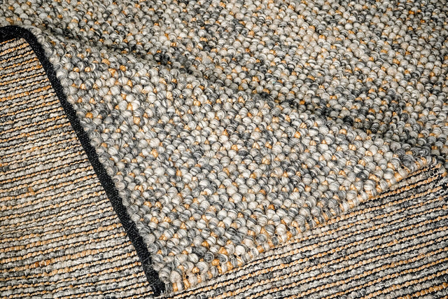 Charcoal grey rug styled in a living room