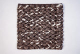 Brown ivory wool loop rug styled in a living room