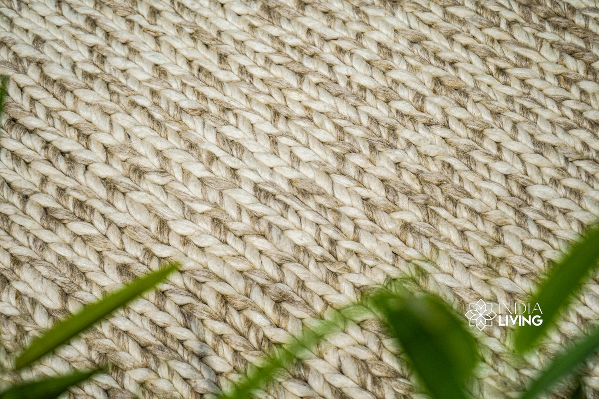 Beige braided wool rug full pattern overhead view