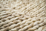 Close-up of the beige braided wool texture