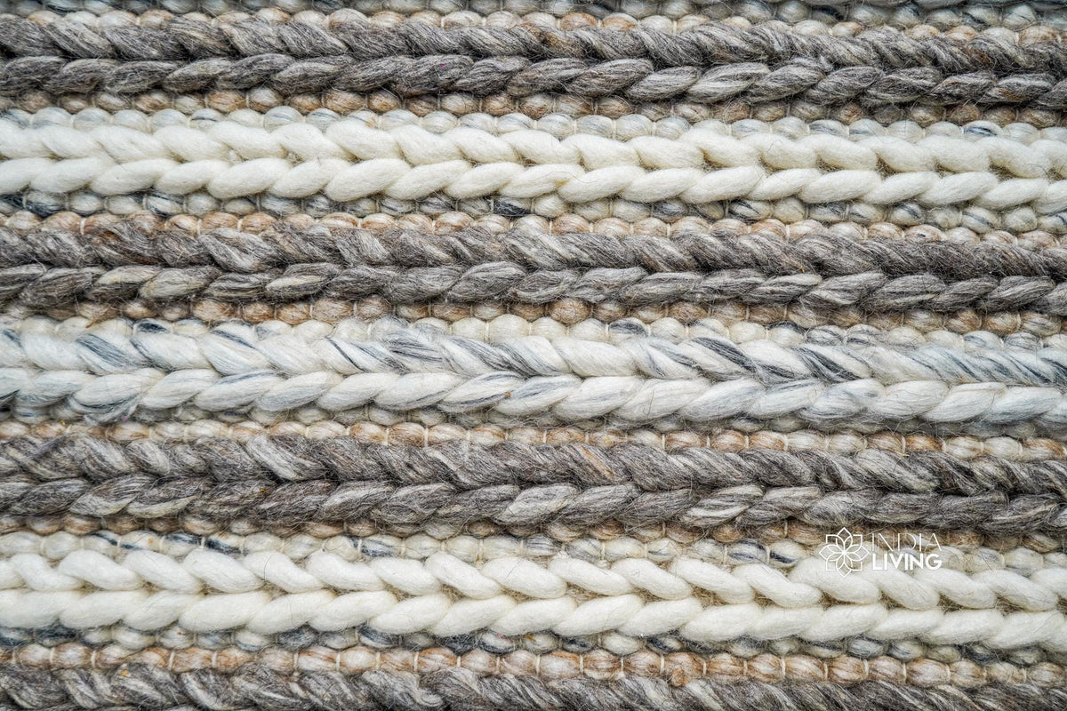 Chunky knit wool rug styled in a living room setting