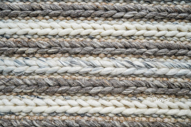 Chunky knit wool rug styled in a living room setting