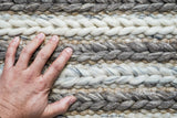 Wool rug styled near a fireplace