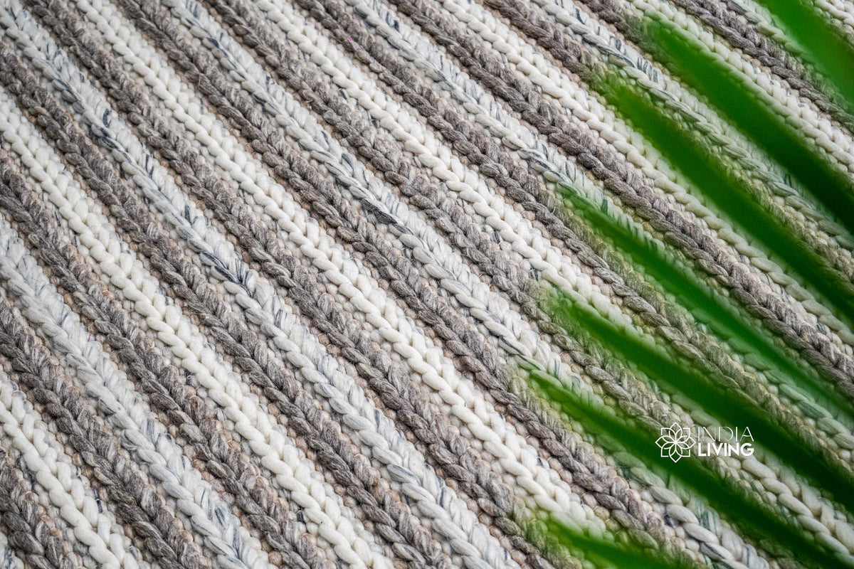 Chunky knit rug texture close-up in natural light