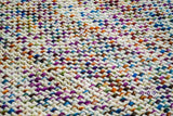 Chunky wool rug rainbow color close-up detail