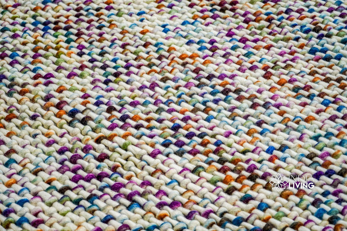 Chunky wool rug rainbow color close-up detail
