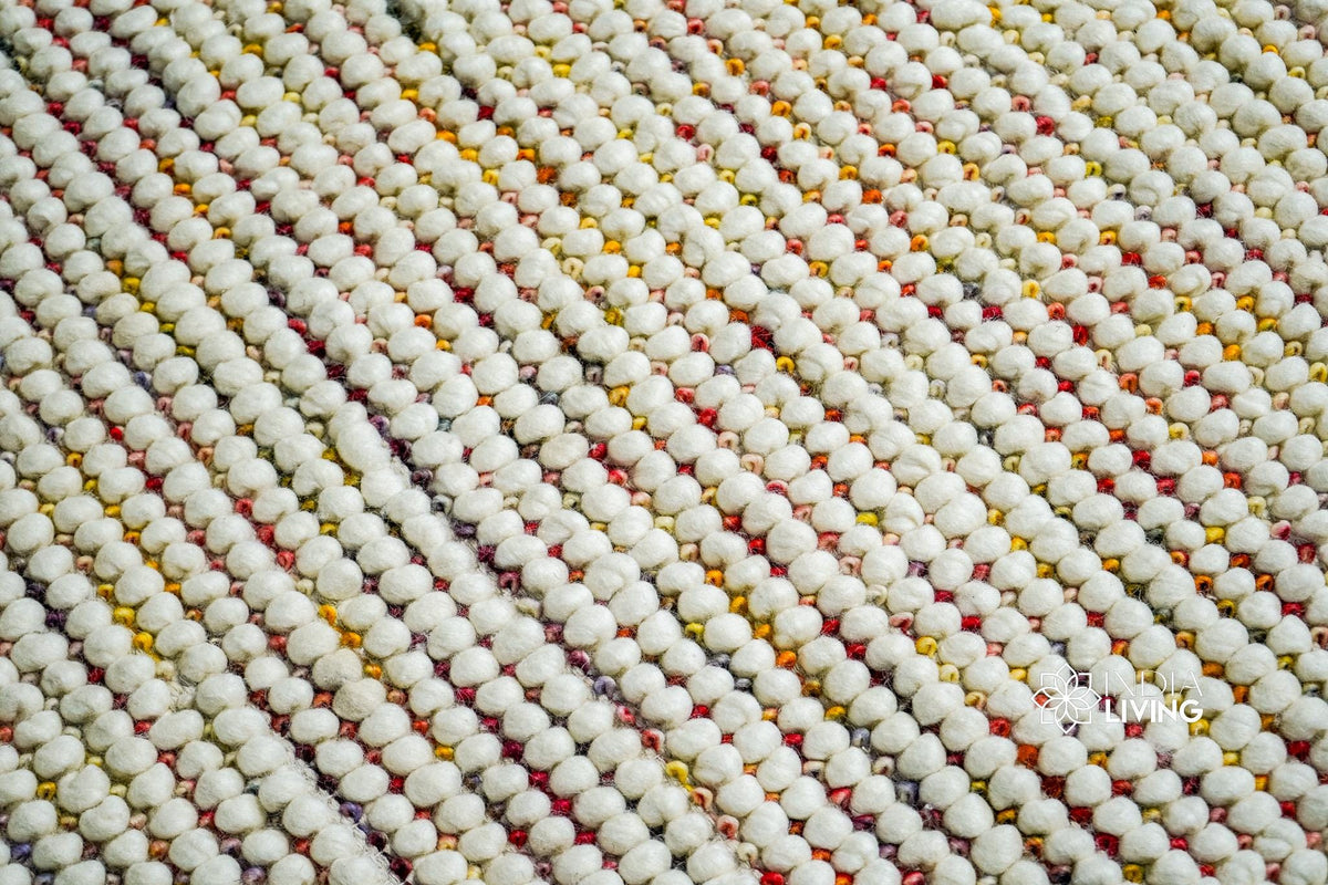 Chunky wool rug pile close-up showing color blend