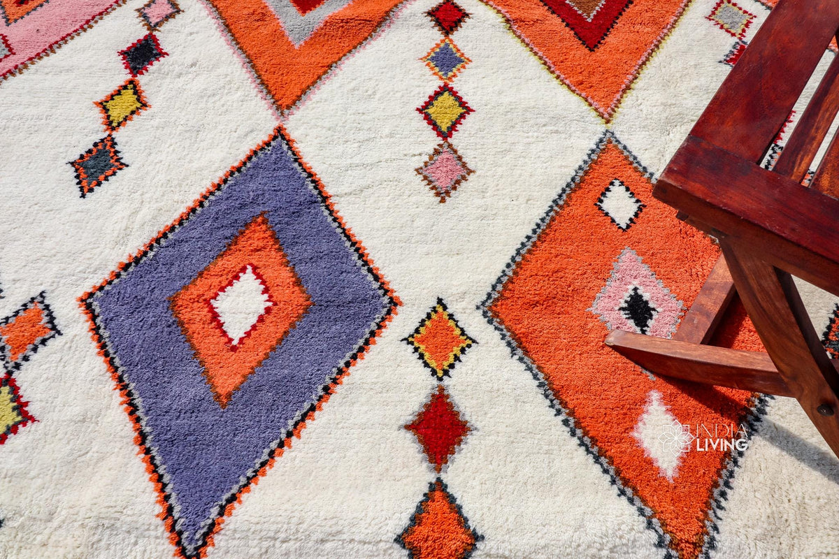 Wide shot of colourful Moroccan rug in a bright room