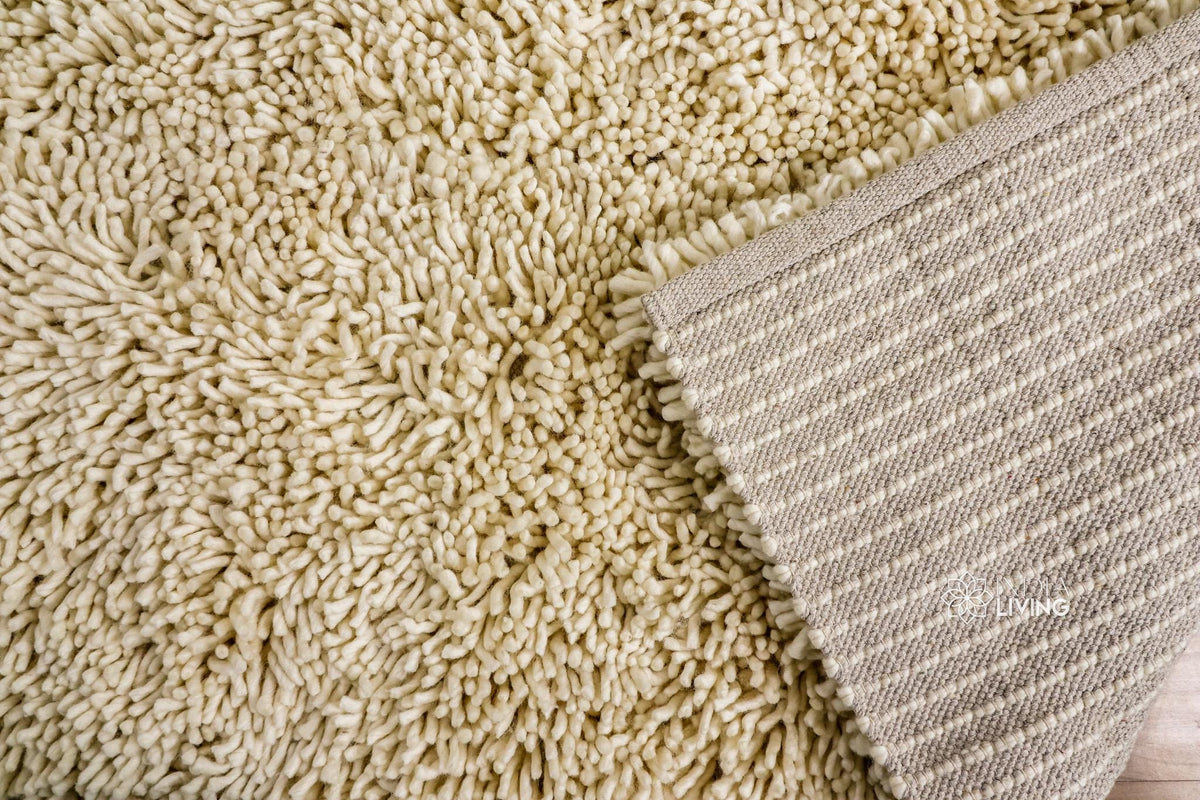 Close-up of ivory shag wool pile texture