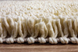 Ivory rug corner detail showing felted shag pile