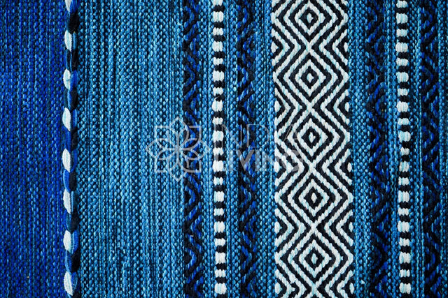 Diamond pattern detail on blue kilim rug