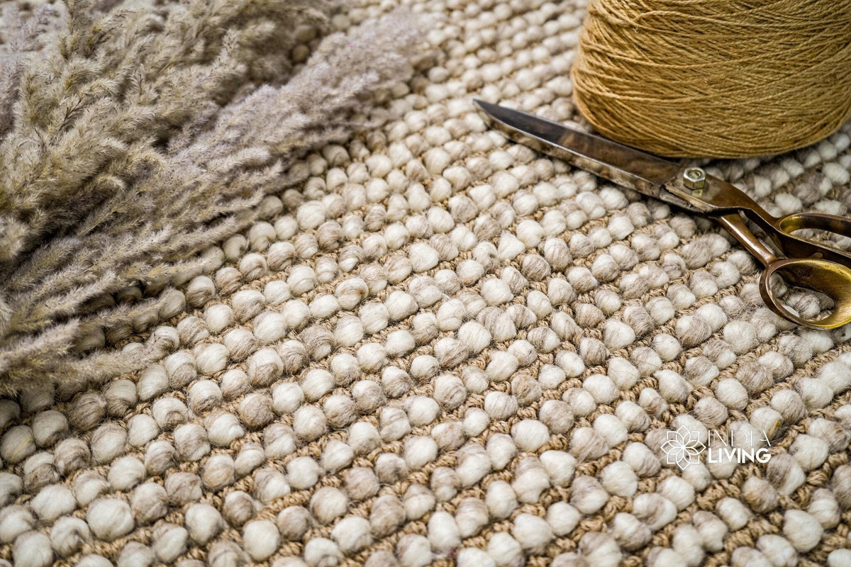 Camel beige rug styled with a pet nearby