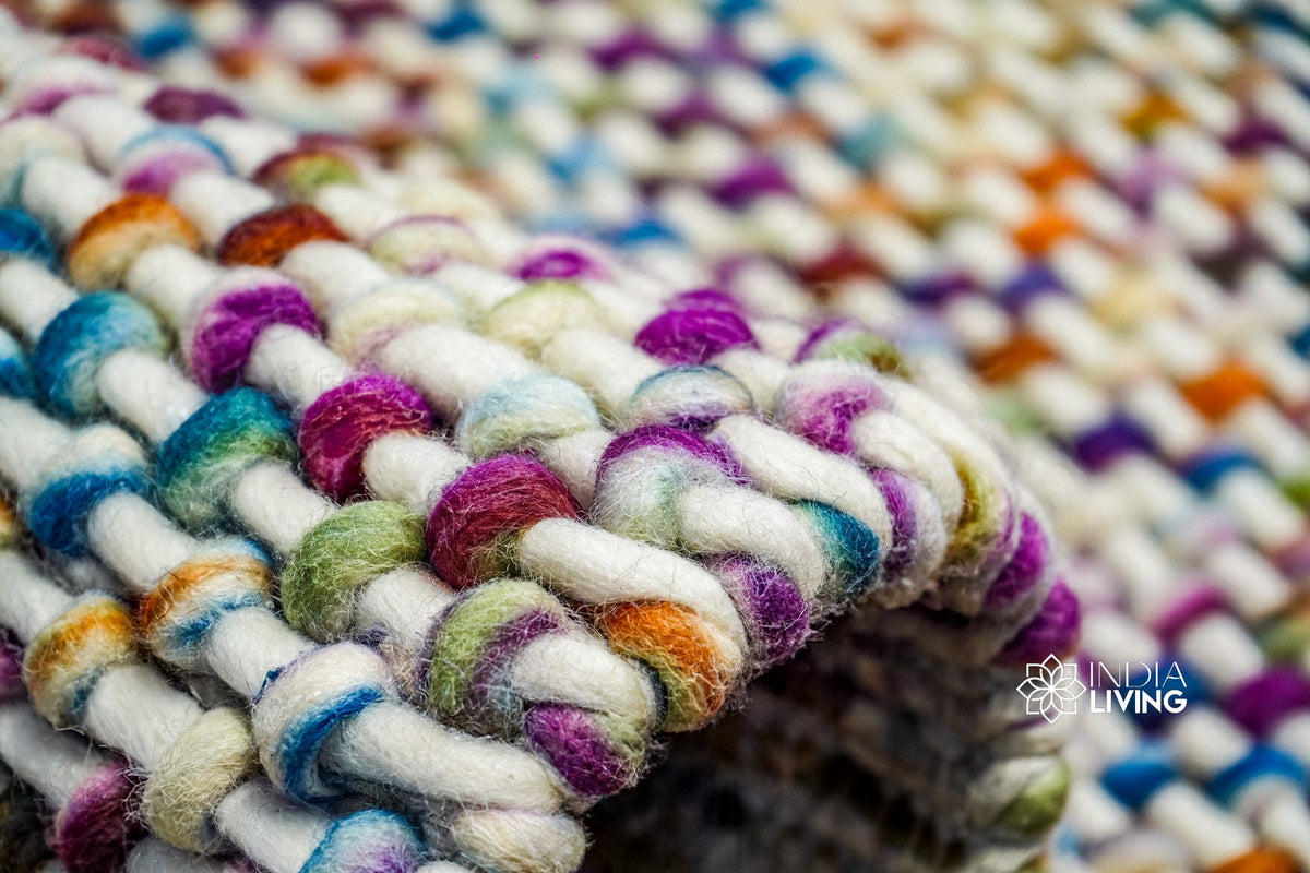 Full room view with rainbow basket knit rug