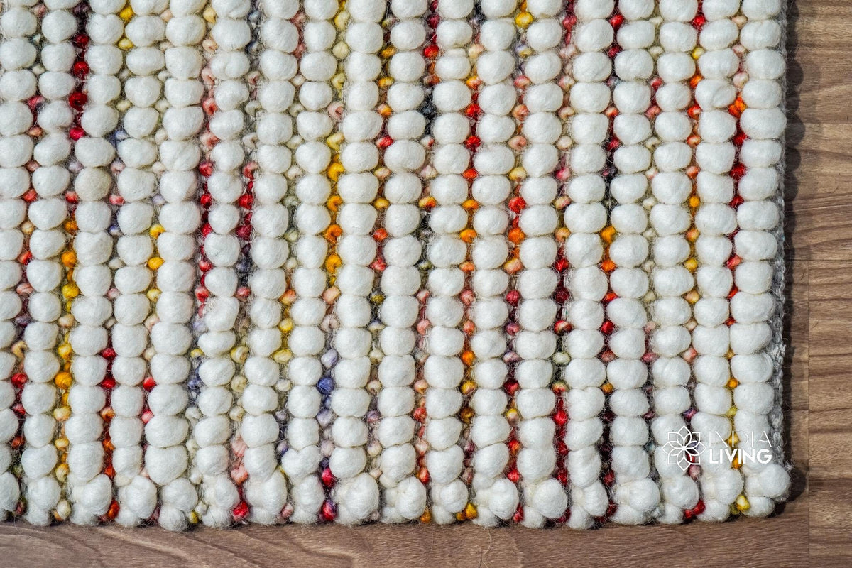 Colourful wool rug styled with kids furniture