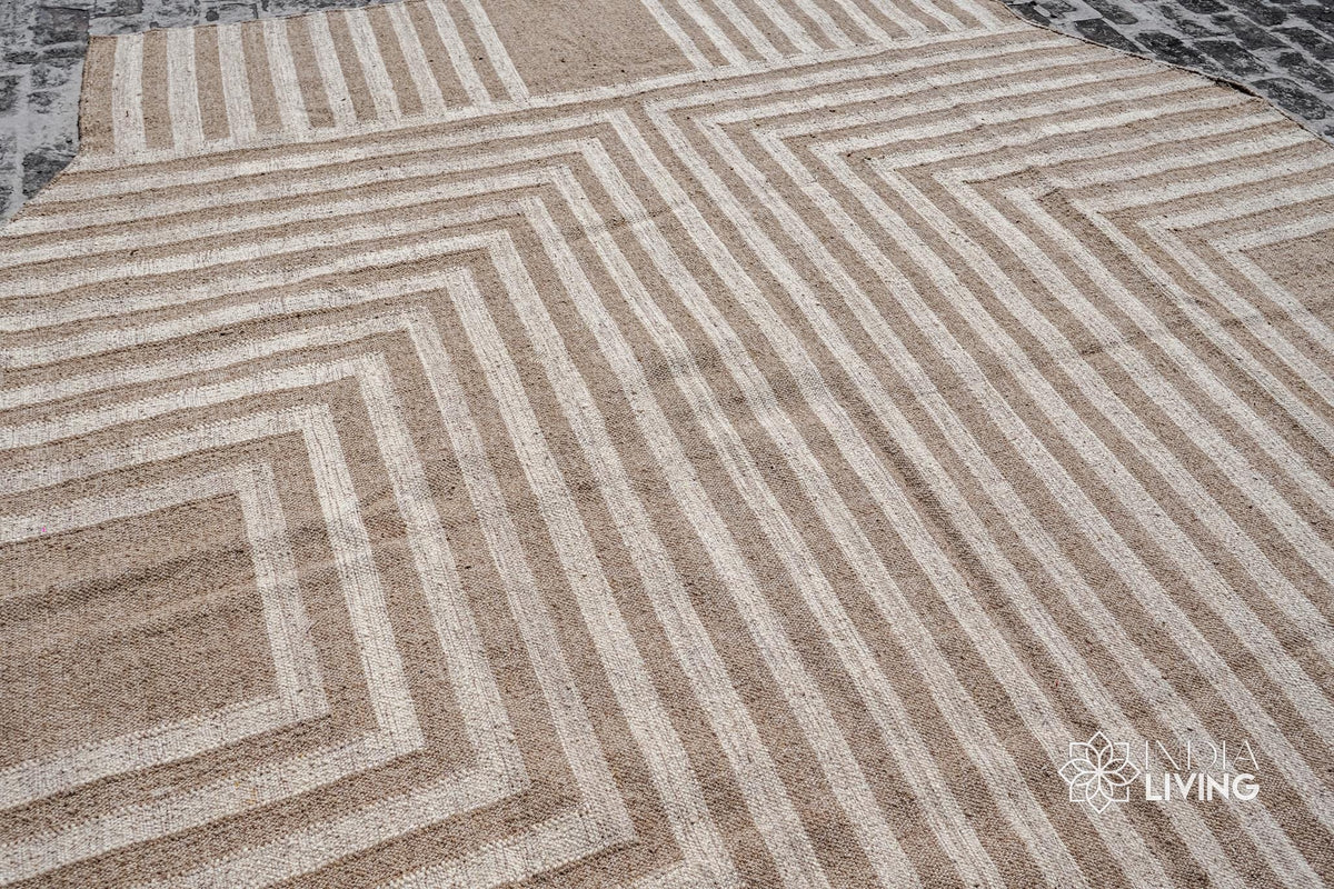 Beige rustic kilim rug under a chair