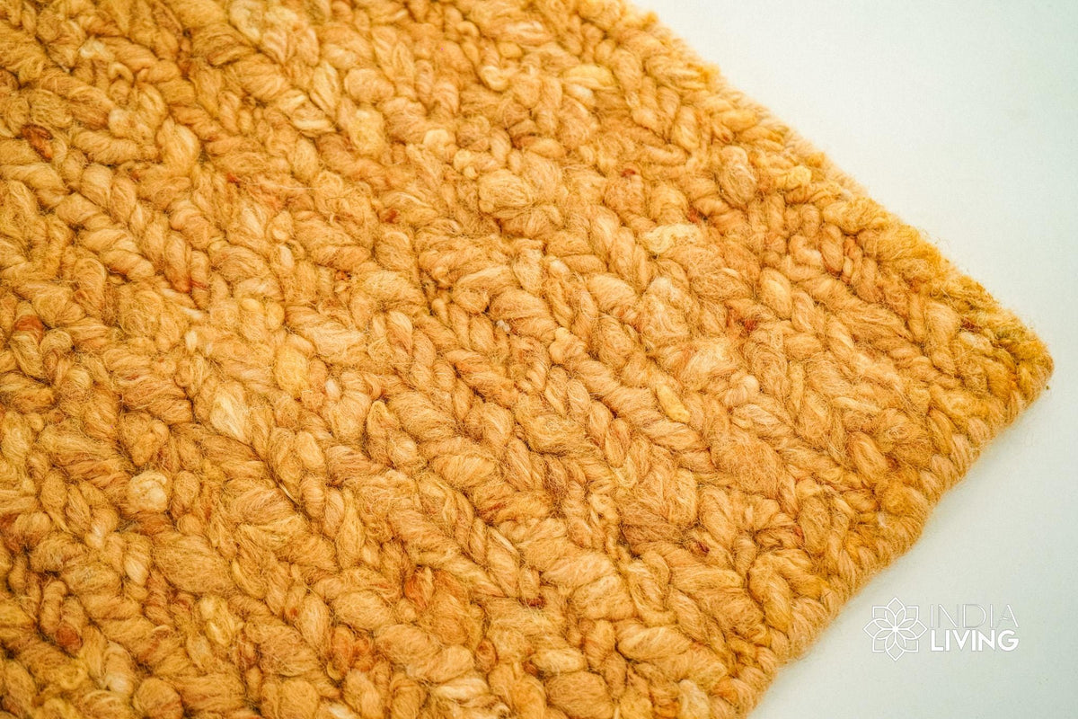 Orange textured chunky wool rug, flat lay view