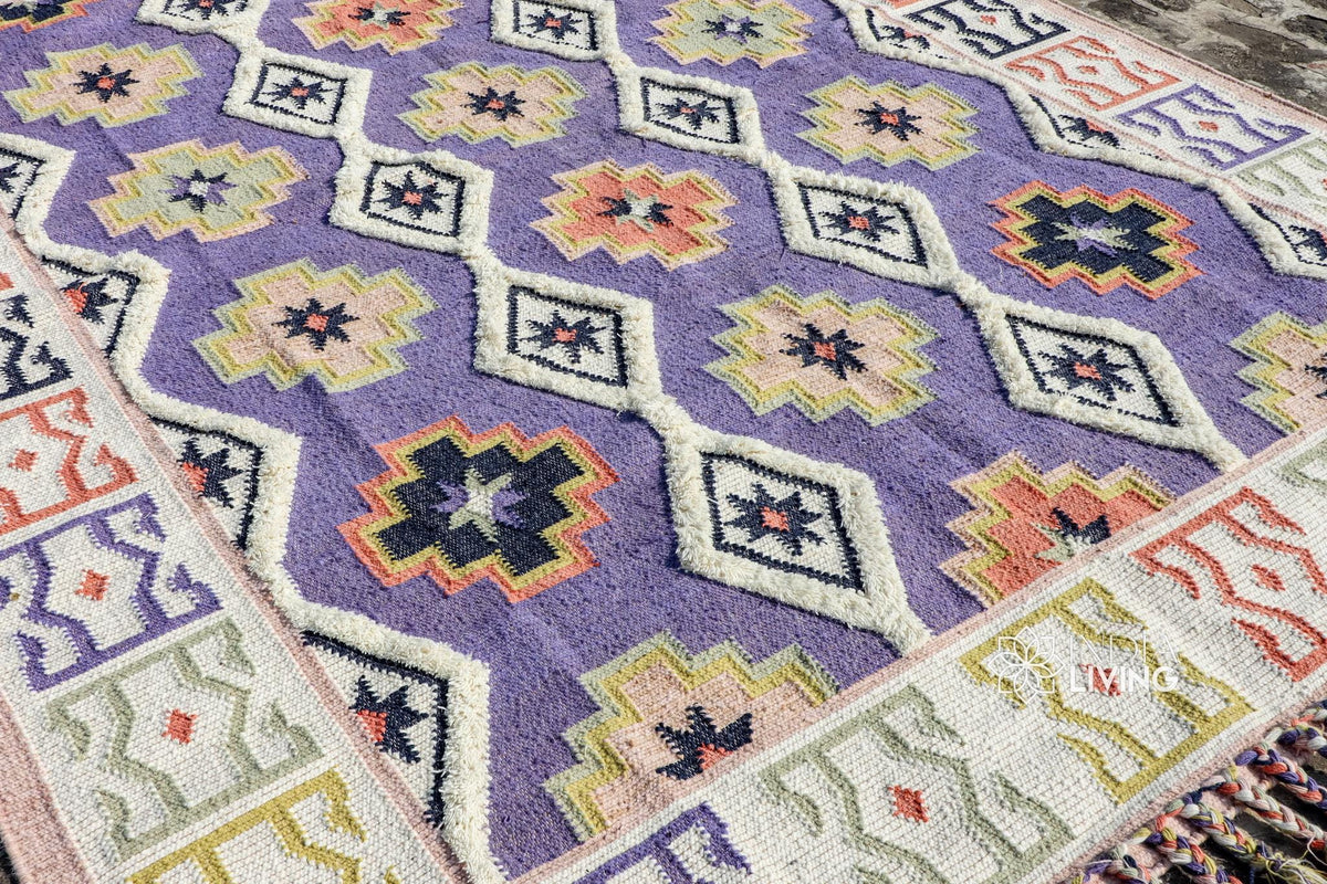 Purple kilim rug styled in living room