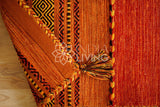 Orange kilim rug pile close-up texture