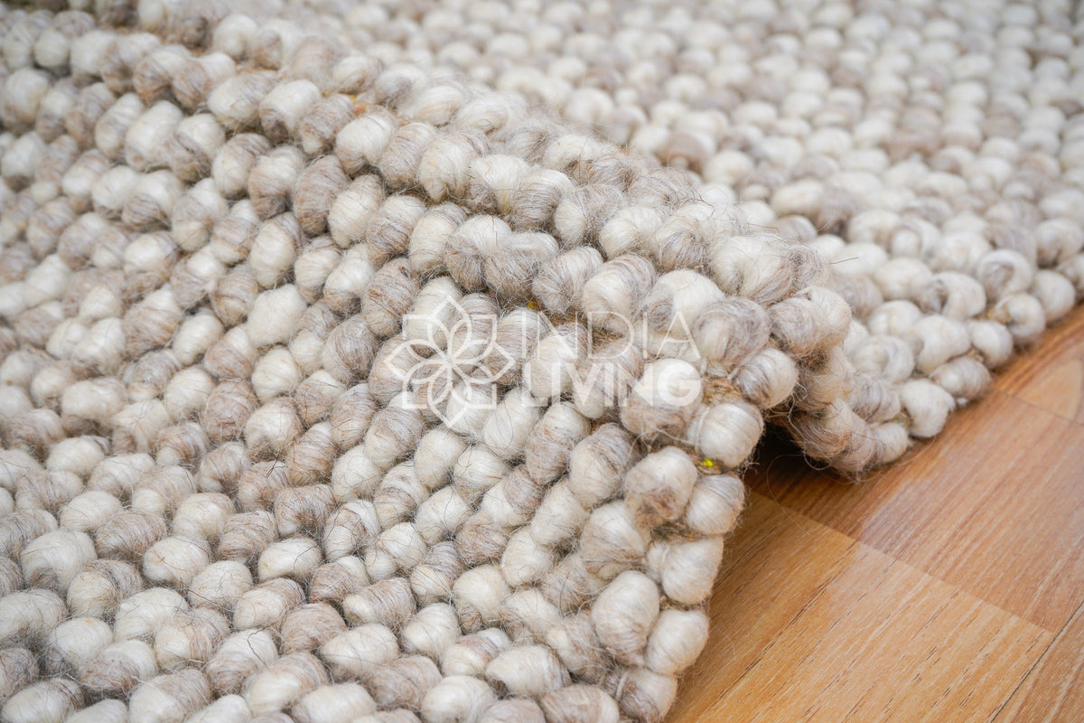 Beige mix chunky looped wool rug flat view
