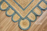 Aqua blue jute rug styled in a living room