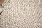 Full-length overhead view of ivory basket weave rug