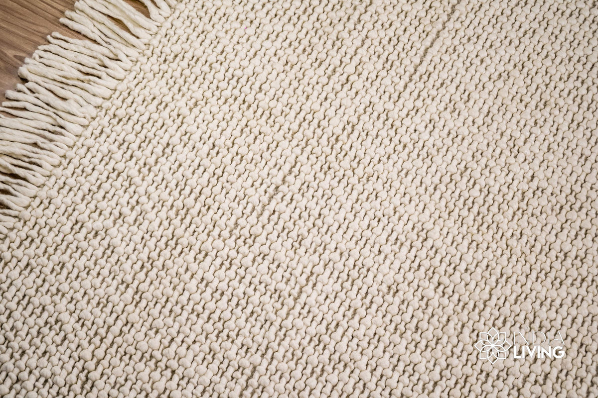 Full-length overhead view of ivory basket weave rug