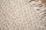 Ivory wool rug under a coffee table lifestyle shot