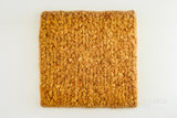 Close-up of orange chunky wool texture