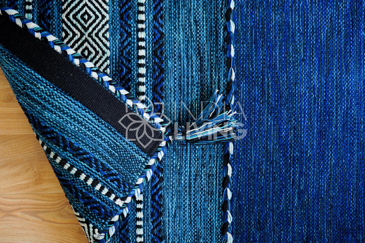 Blue kilim rug styled in a living room