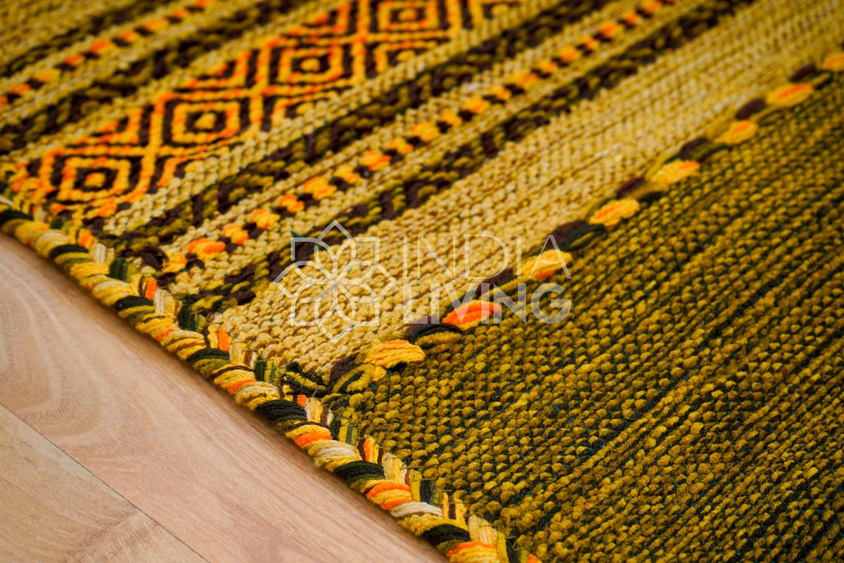 Close-up of cotton chenille weave on green kilim rug