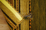 Overhead view of green kilim rug