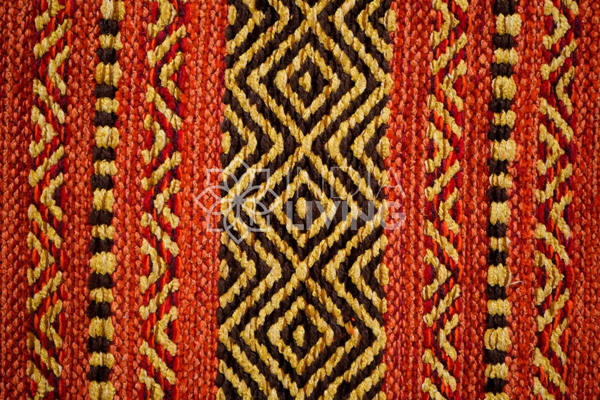 Full view of red kilim rug in natural light