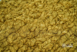 Olive green wool rug edge and binding detail