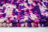 Purple wool rug edge and border detail