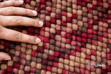 Beige red wool rug texture close-up