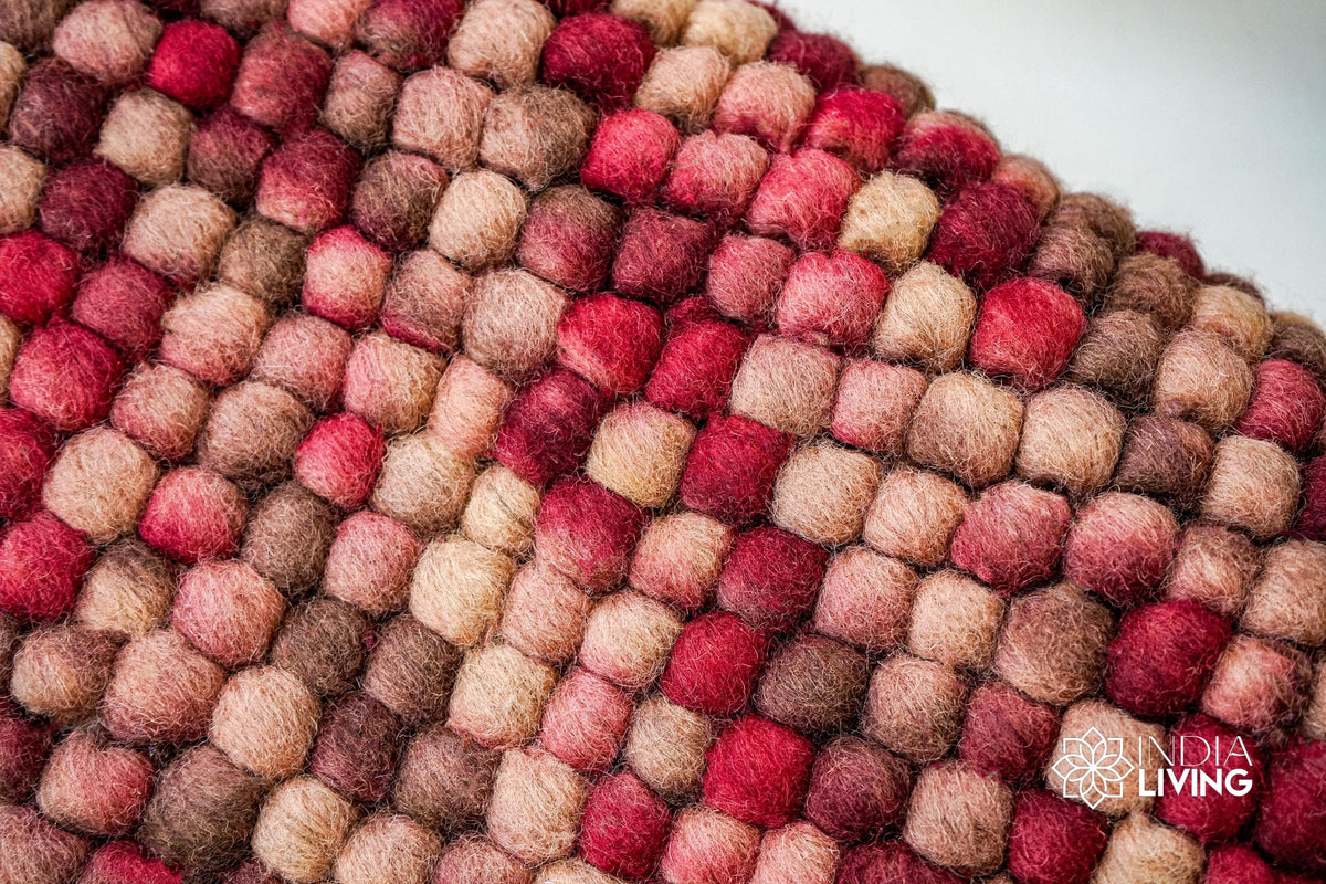Beige red wool rug in a bedroom decor setting