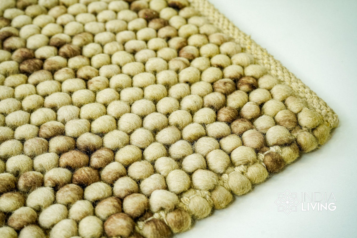 Coffee beige wool rug in a Scandinavian bedroom setting