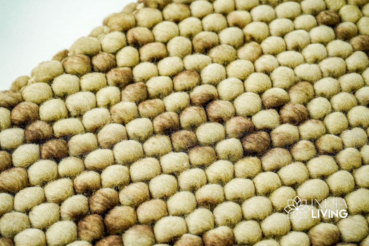 Coffee beige wool rug corner detail showing reversible edge