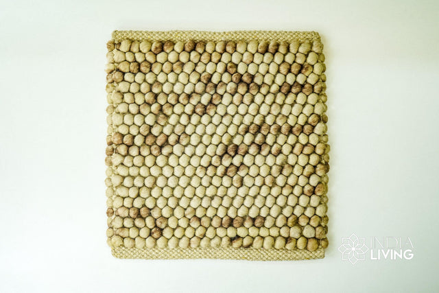 Coffee beige wool rug styled in a living room setting