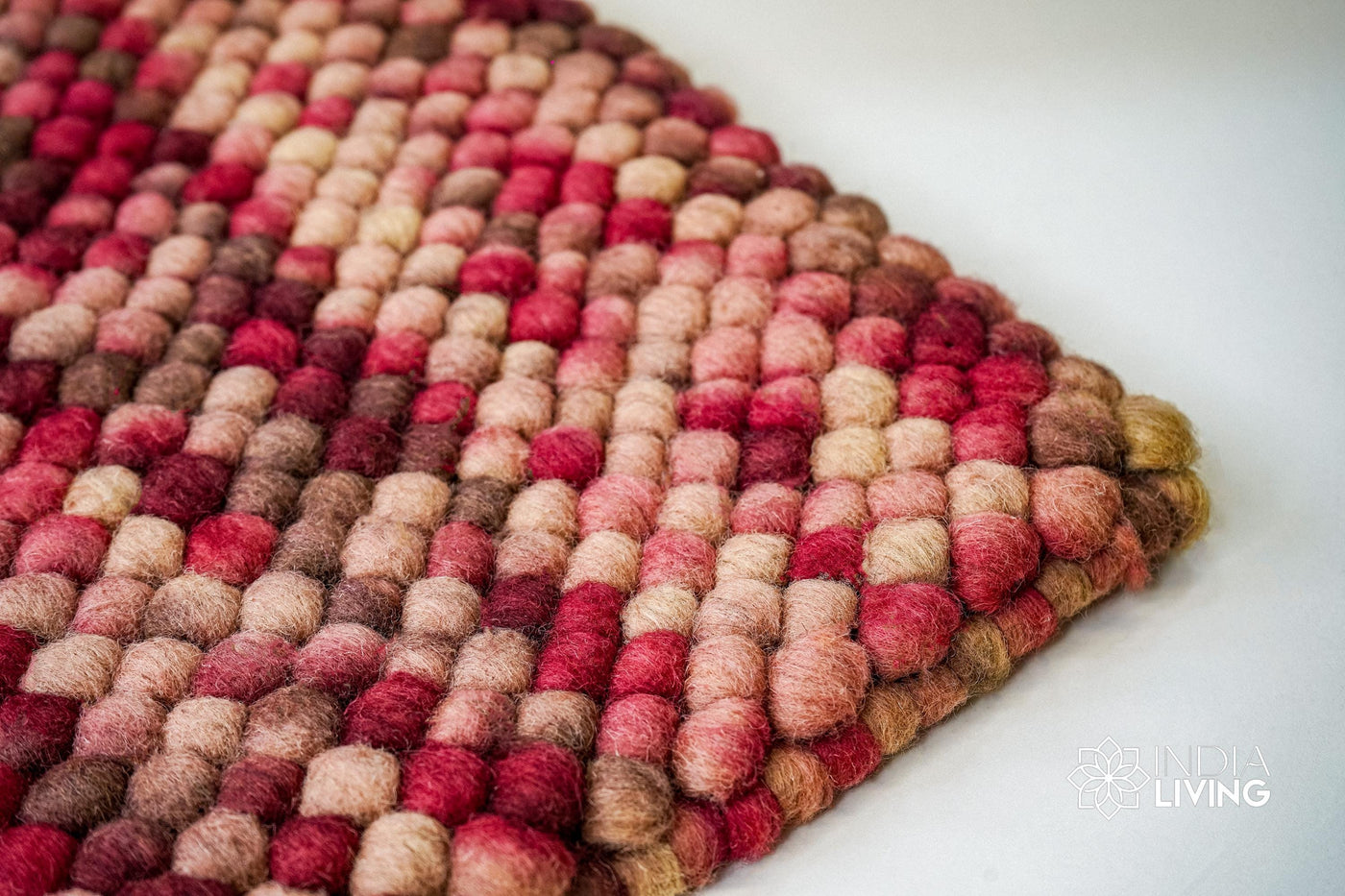 Rustic beige red chunky wool loop rug flat lay showing texture
