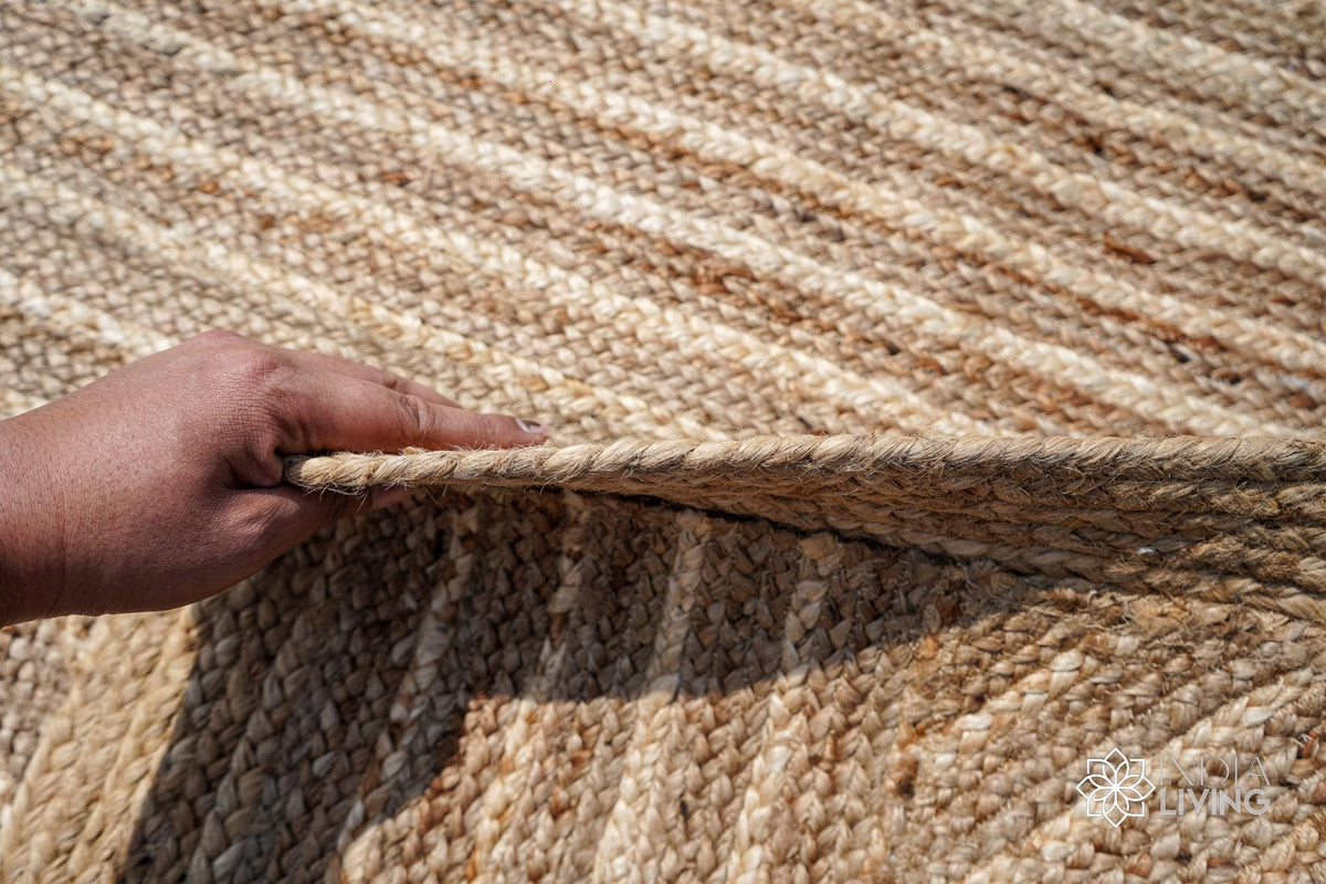 Natural jute rug in a bedroom styling
