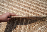 Natural jute rug in a bedroom styling