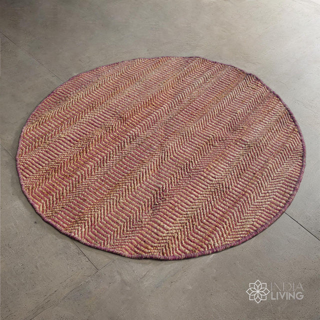 Natural pink round jute rug flat lay showing woven texture