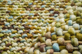 Green wool rug colour blend close-up