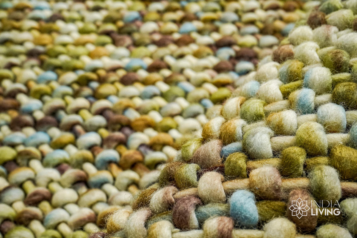 Green wool rug colour blend close-up